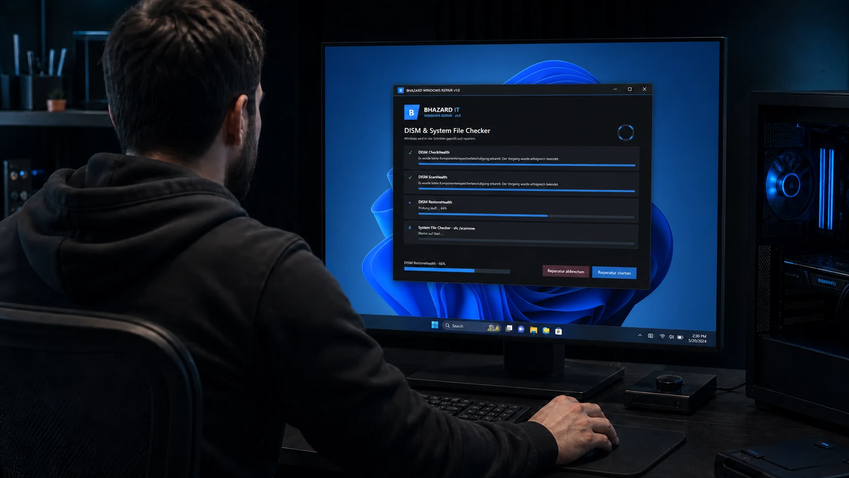 Techniker von hinten vor einem Monitor mit dem BHAZARD IT Win-Repair-Tool